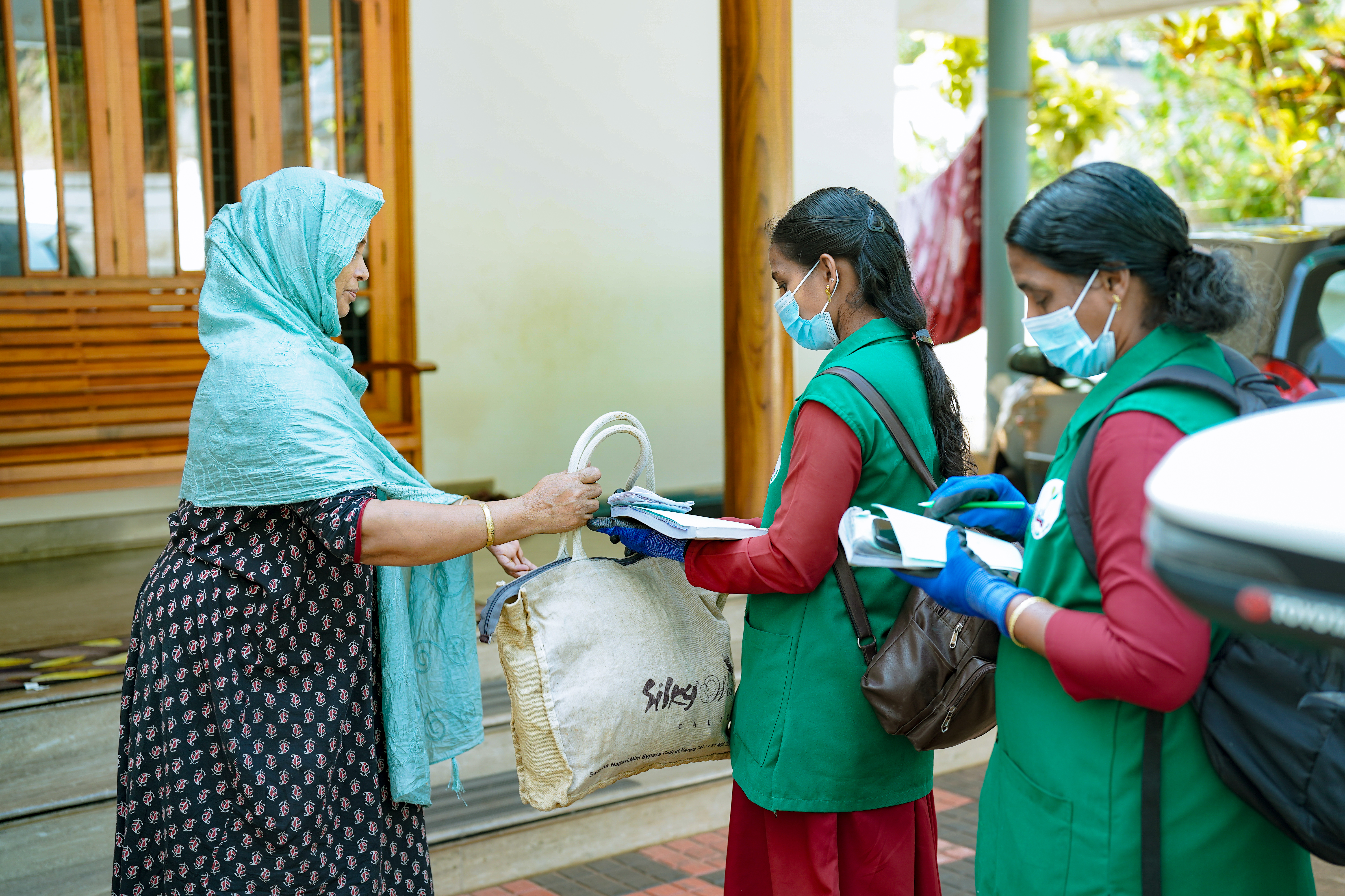 Community textile waste collection program with local partners distributing materials